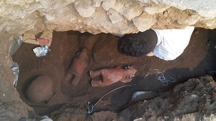 1,700-year-old untouched tomb yields elaborate headdress figurine 
